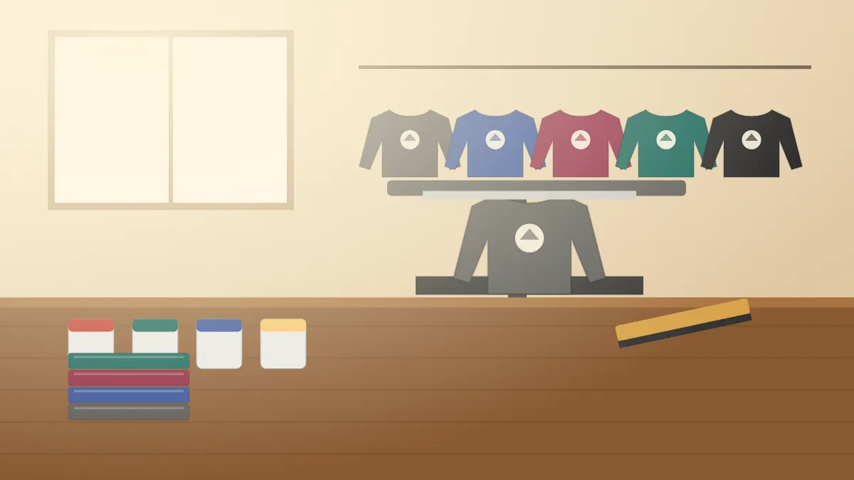 Illustration of crew-neck sweatshirts in grey, navy and burgundy hanging above a print press